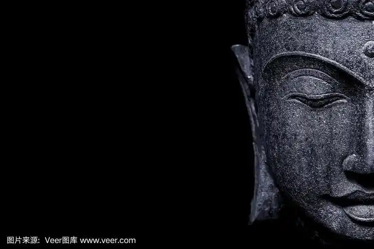 佛像的脸在黑色的背景上
