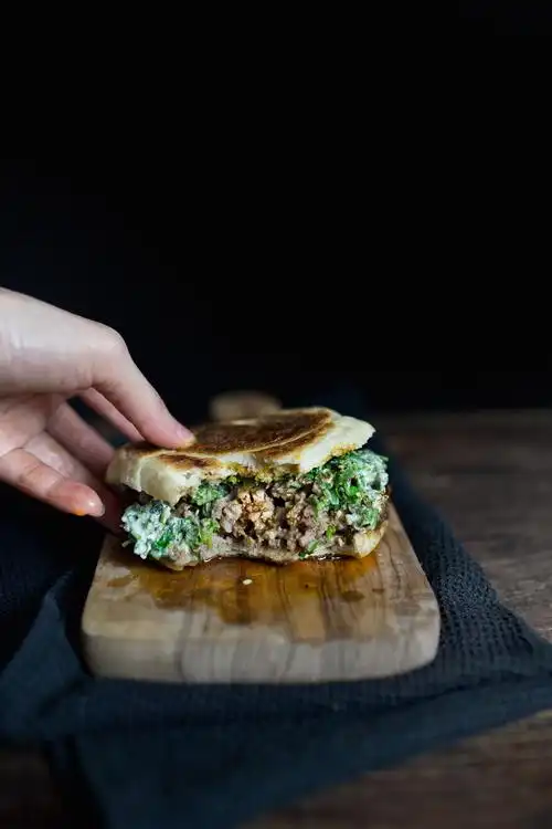 xian style smushed lamb meatball burger