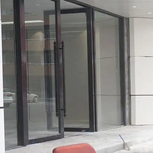深圳定制商铺钢化玻璃门制作灰色铝合金双平开门加工地弹玻璃门
