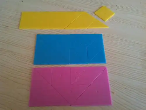 用一幅七巧板摆成不同的长方形,那么它的长与宽成什么比例关系,说明