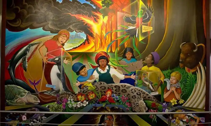 更具深意的内容——首先某个小女孩竟怀抱着预示世界末日的玛雅人石板