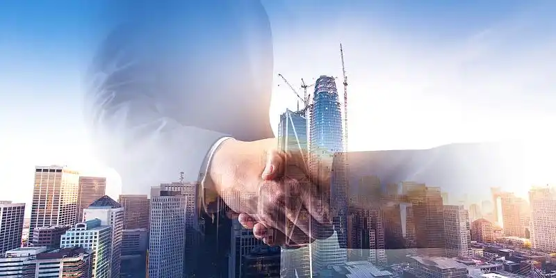 蓝色场景大气西装握手城市商务展板背景