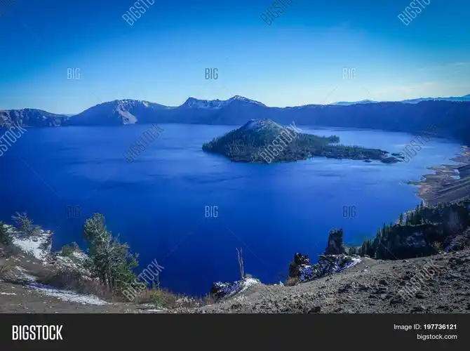 looking at the vast expanse of the crater lake caldera in oregon
