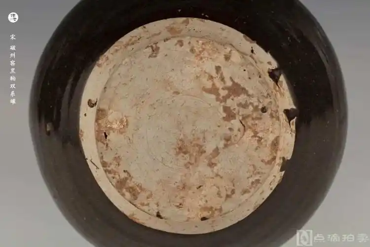 2cm,高19cm 品相:底足小磕         宋 磁州窑黑釉双系罐 口径17.