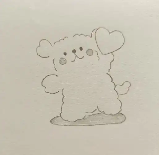 2 在右侧稍高的位置,画上一颗小小的心形,代表小狗的头部