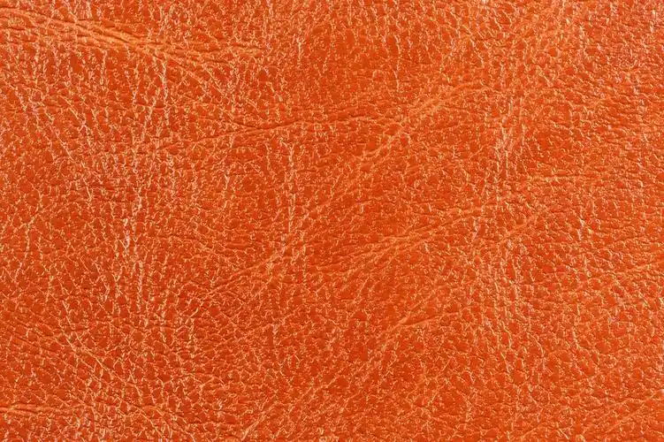 深橙色光泽皮革背景纹理