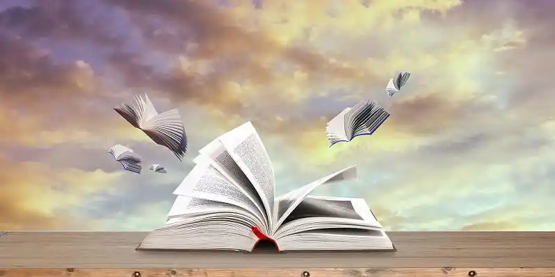 简约文艺云彩上的书籍清新展板背景