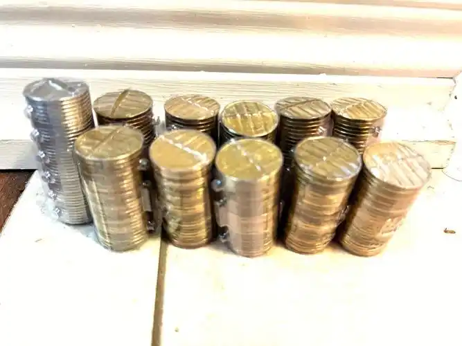 成了透明的,名字叫做coin wrappers,一包卖$2,里面有5种硬币包各5个