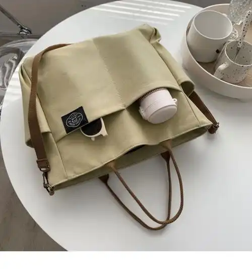 原创自制日系多口袋大容量托特帆布包简约书包手提单肩斜挎包男女高档