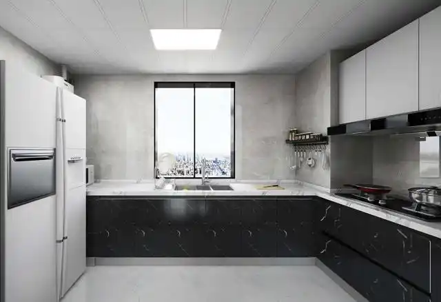 厨房设计选择了低调的浅灰色调,搭配黑色柜门,对比层次效果明显