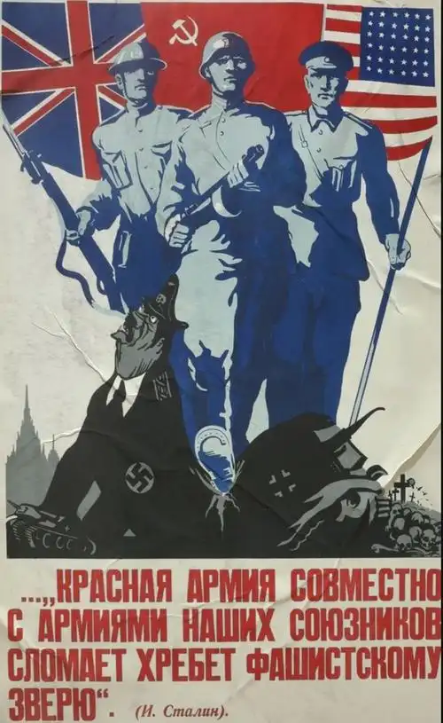 来势汹汹的苏联红军攻入柏林后,一名苏联红军战士将"镰刀锤子"红旗插