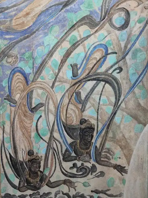 莫高窟第321窟,飞天身体轻盈,姿态优美舒展,华丽而别致.