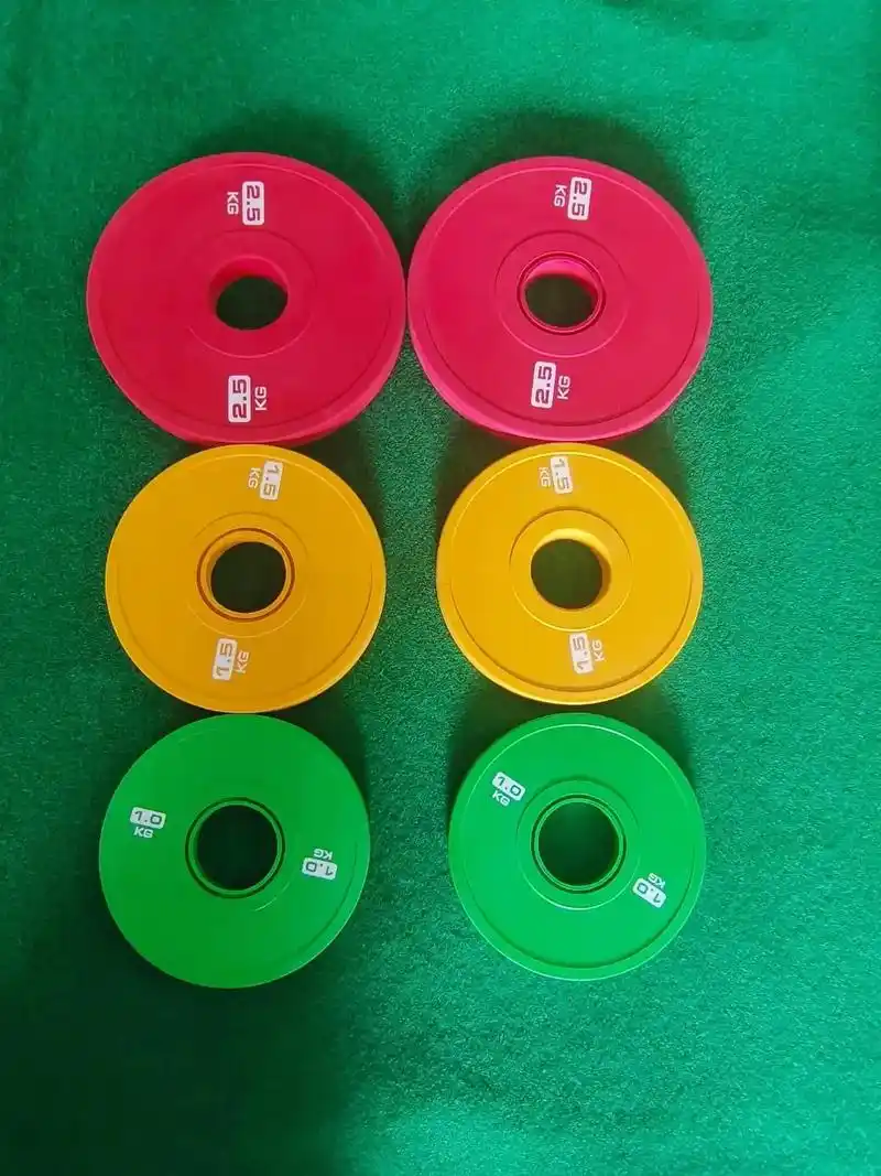 女子杠铃片,五彩缤纷的颜色,让生活更炫丽.杠铃片属于重量训练 - 抖音