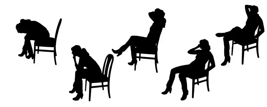 女性矢量剪影.,妇女坐在椅子上的向量轮廓.