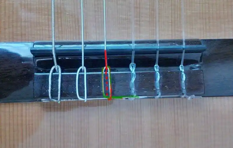 怎样系古典吉他尼纶弦