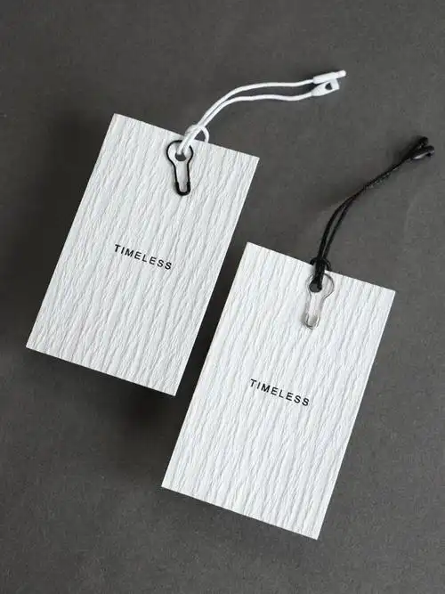高档服装店女装吊牌定做特殊纹理纸吊卡定制文艺简单轻奢风格logo设计
