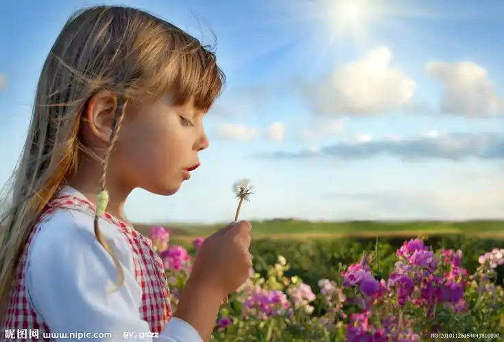 吹蒲公英的小女孩图片