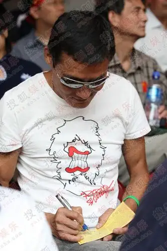 梁家辉携女鸟巢助威 自爆曾是200米飞人(图)