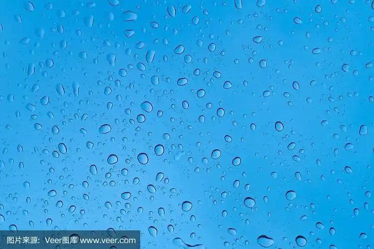 雨滴落在蓝色的玻璃上