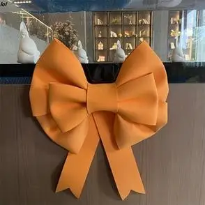 网红巨型桔橘橙色蝴蝶结婚庆房间门墙装饰节日布置海绵纸手工diy