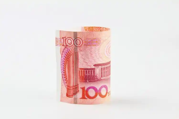 百元人民币堆放背景图片