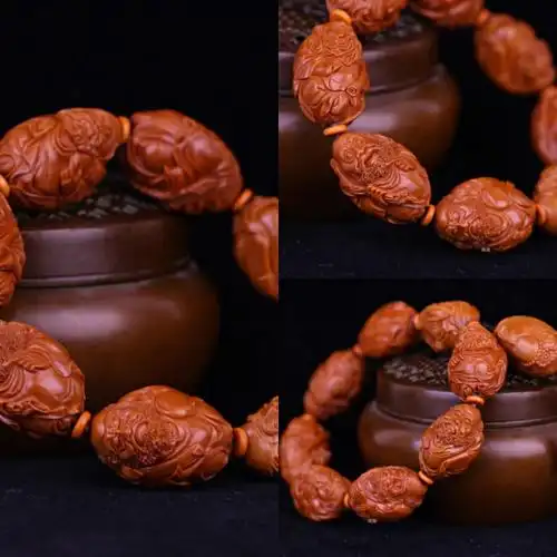 周泉兴老师的这款橄榄核雕精品《达摩》雕工立体,极品老铁核雕刻完工