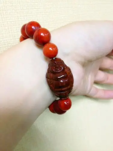 凉山火焰纹南红配橄榄核罗汉手串