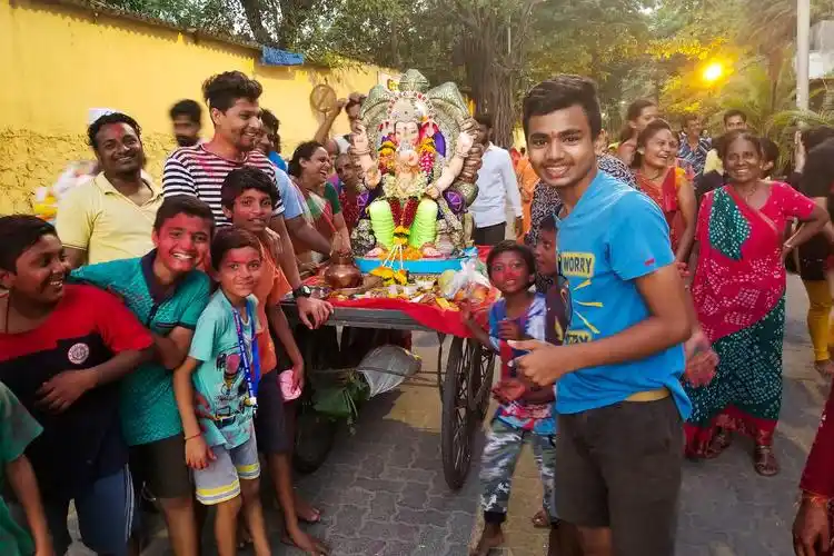 indians are partying and praying for elephant-headed god ganesh