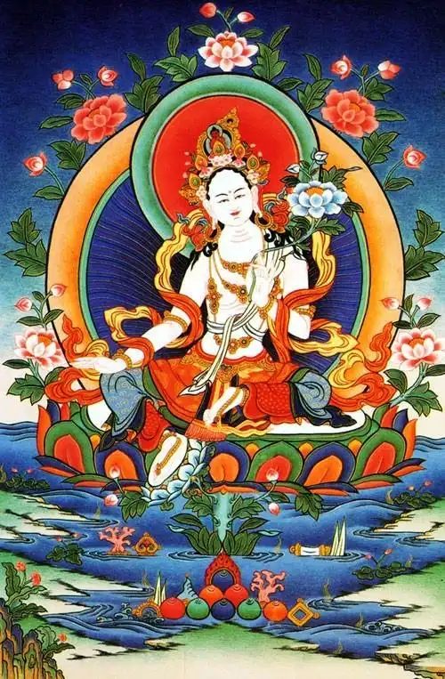 身白色,右手向外伸展以施无畏,左手持莲花.