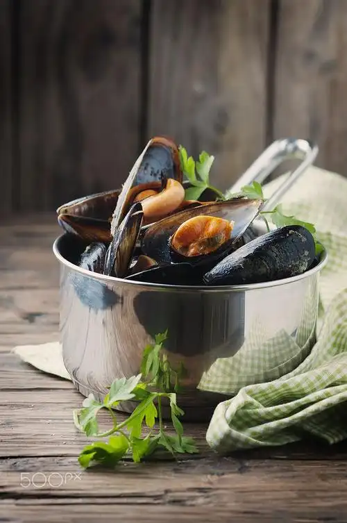 cooked mussels with garlic and parsley by oxana denezhkina on