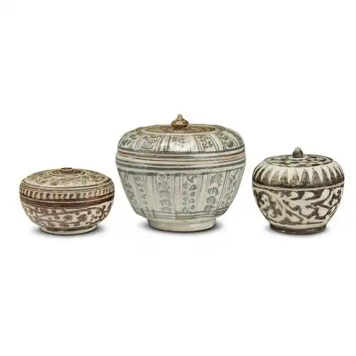 three thai iron-brown decorated jars and covers
