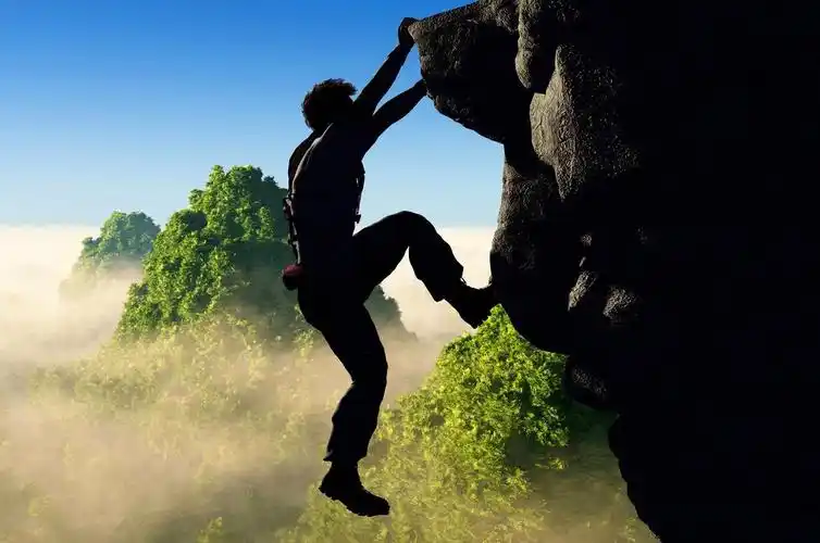 登山者攀岩励志背景图片两个登山者手的侧面影像励志努力坚持不懈克服