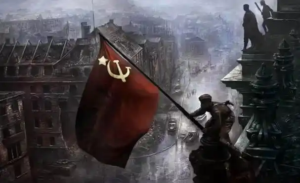 德国柏林国会大厦的楼顶飘扬起了一面鲜红的镰刀锤子旗,苏联英雄米哈