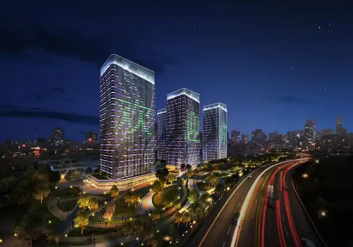 某个立面幕墙像叶子的商业建筑夜景灯光设计