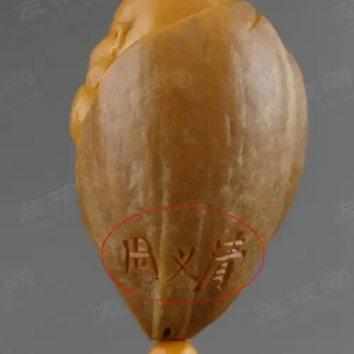 如何挑选核雕大师周义清的弥勒?