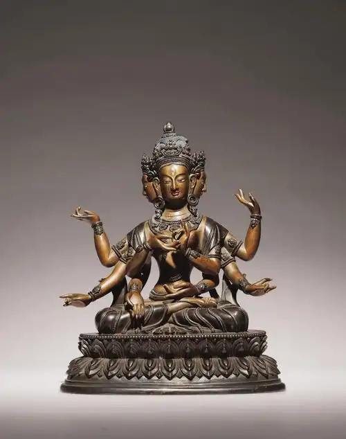 清十八世纪 铜泥金嵌银三面八臂佛