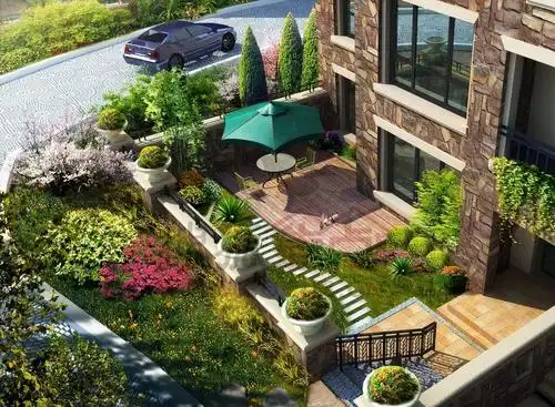 私家别墅园林设计用中国式的景观石搭成假山造景,山石边,绿色景观遮掩