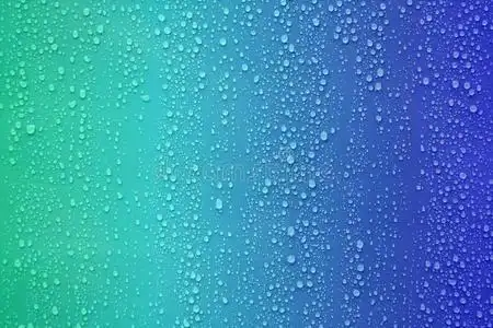 水滴在蓝色渐变背景上.照片