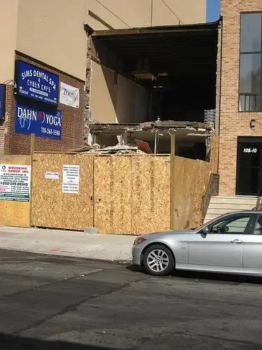 east side 72nd ave historic rowhouse being demolished & site