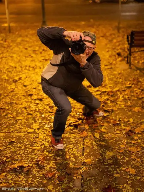 nighttime urban male street photographer taking pictures