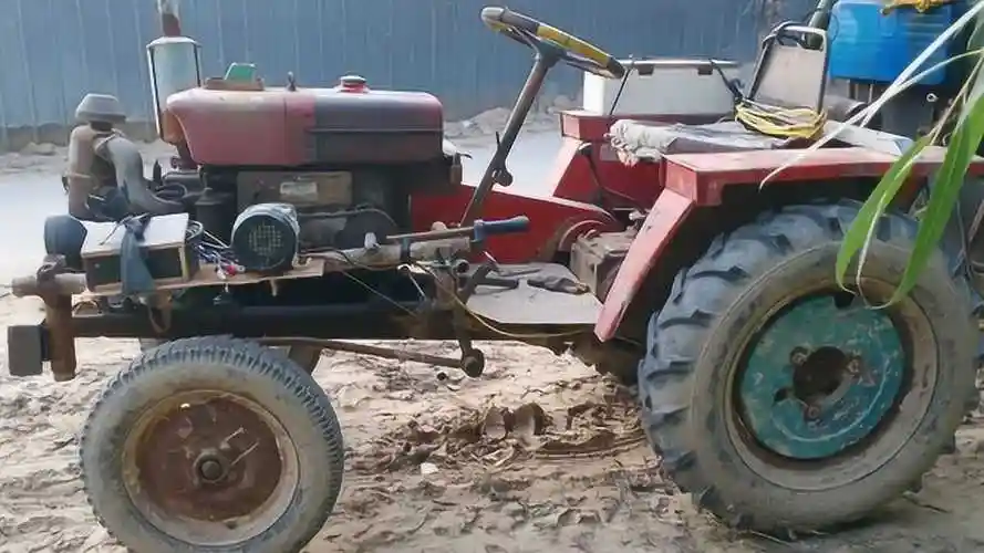实拍农村四轮拖拉机,这样改装的启动器第一次见,能启动吗?