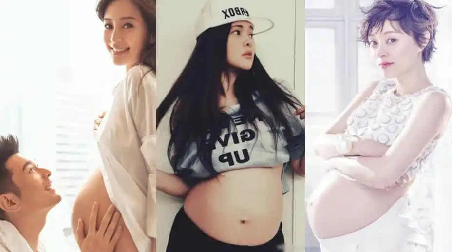 挺着隆起的孕肚,而黄晓明双手捧着肚子,宠溺的望向baby