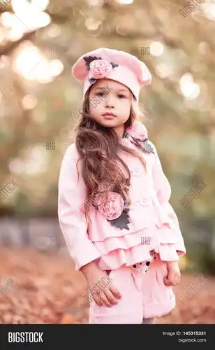 cute baby girl 4-5 year old wearing stylish winter jacket shorts