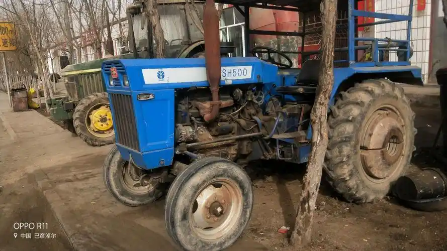 辛福农机具销售中心.经营各种农机具,二手上海50拖拉机,四驱车.配件,