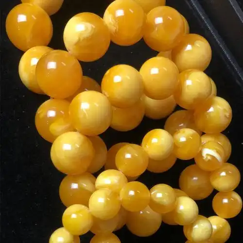 蜜蜡手串鸡油黄飘花鸡油红深飘白花蜜飘花手串厂家直销直播展会