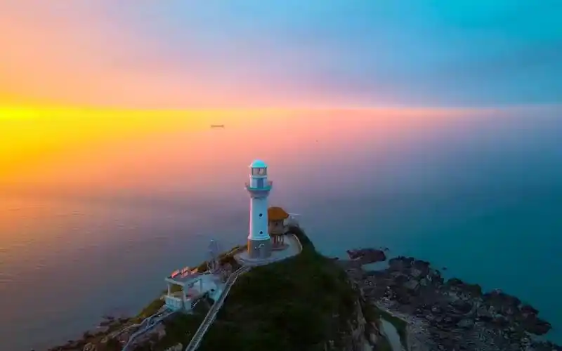 灯塔日落唯美海边风景