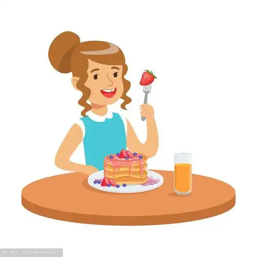 快乐的女孩坐在桌子旁吃着蛋糕