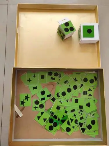 掷骰子:让幼儿在游戏中感受数与量的关系,幼儿拿起骰子,抛到几就要