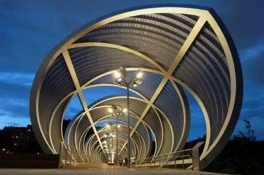 spiraling conical bridge spans madrids manzanares river