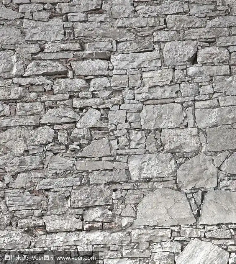 垂直石灰石墙的背景和纹理
